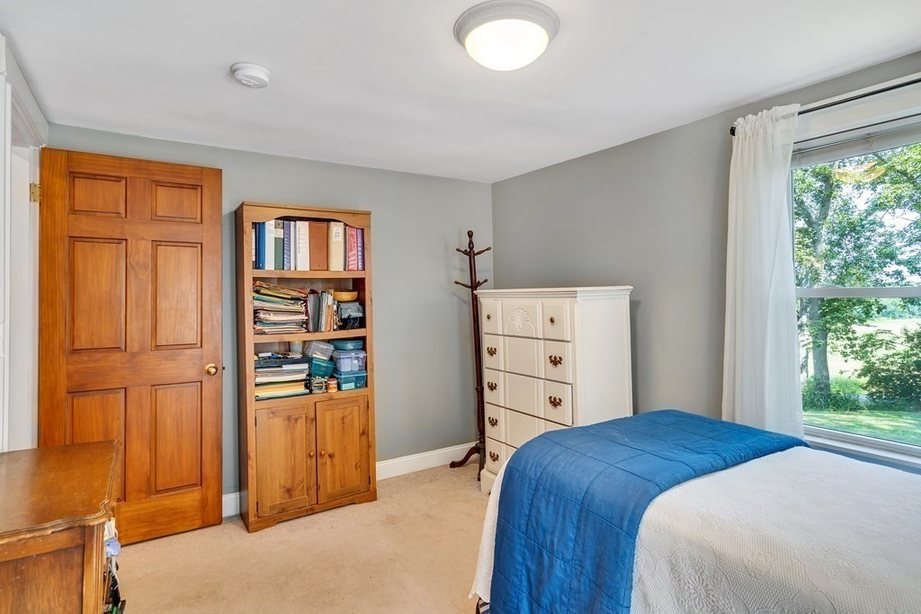 509 Neck Road, Unit 1 Lancaster, MA 01523 - Photo 14 of 19 a bedroom with a bed and a closet