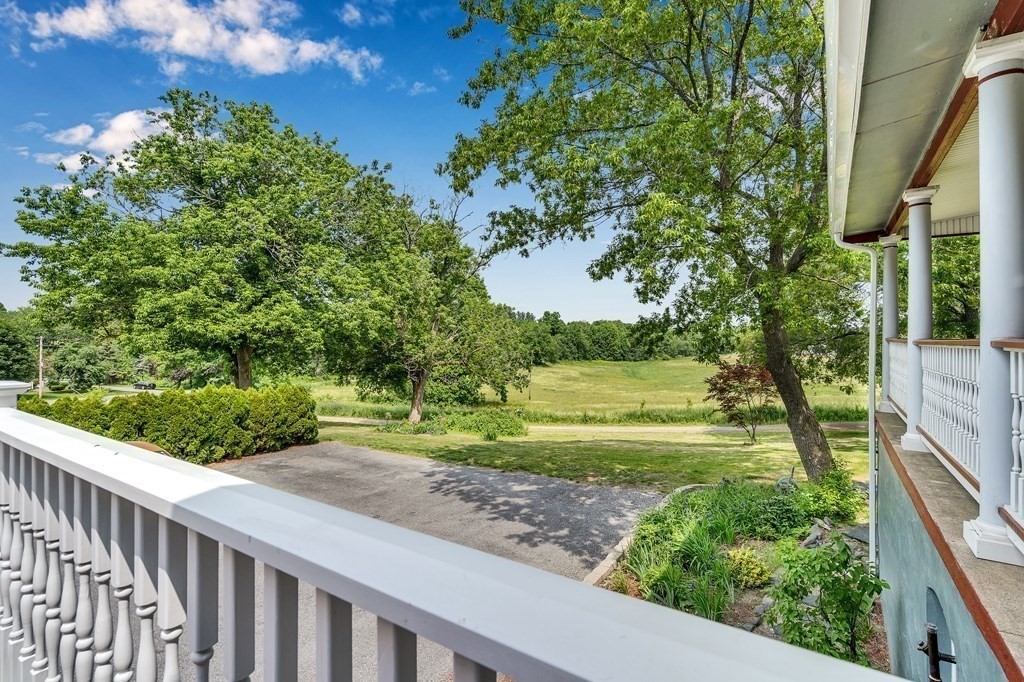 509 Neck Road, Unit 1 Lancaster, MA 01523 - Photo 2 of 19 a view of a garden from a balcony
