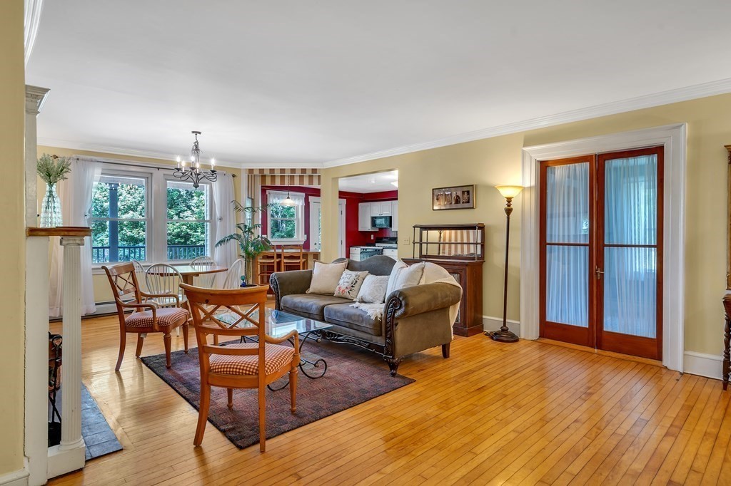 509 Neck Road, Unit 1 Lancaster, MA 01523 - Photo 6 of 19 a living room with furniture a fireplace and a large window