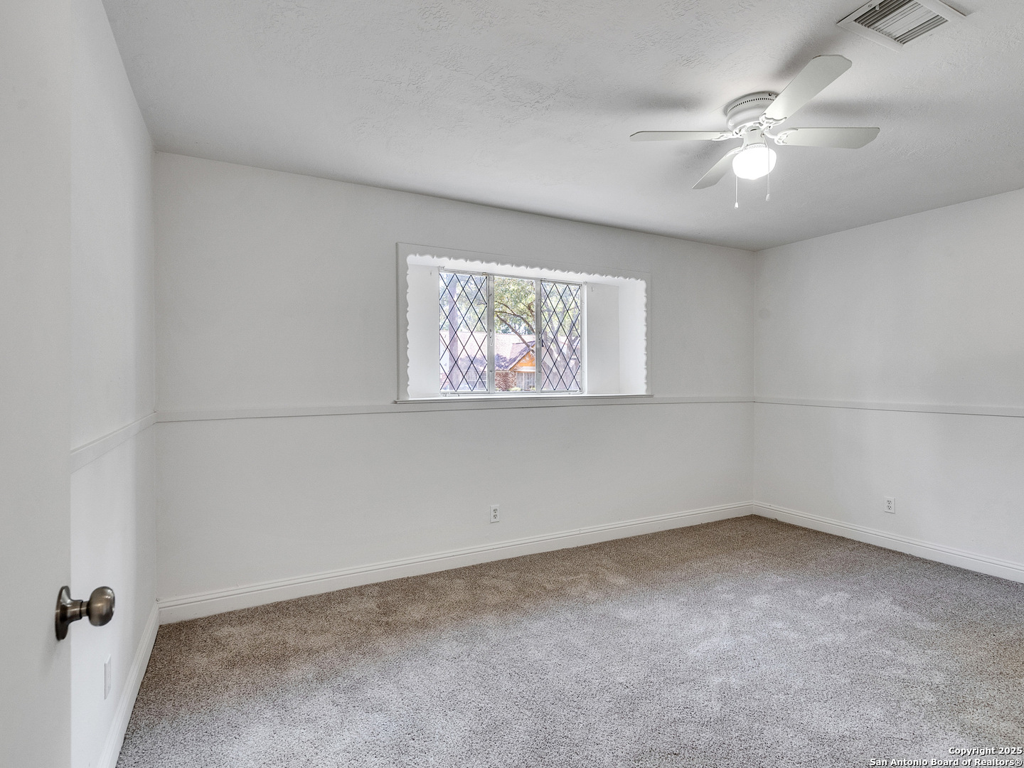 25423 Old Carriage Lane Spring, TX 77373 - Photo 20 of 36 an empty room with windows and fan