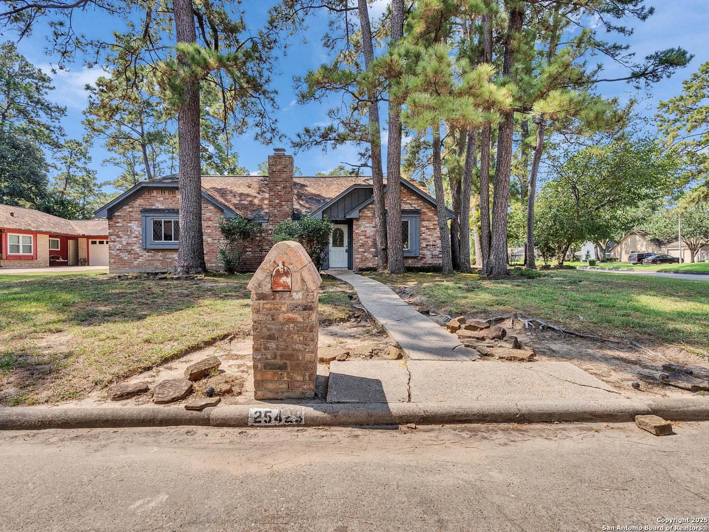 25423 Old Carriage Lane Spring, TX 77373 - Photo 3 of 36 a front view of a house with a yard