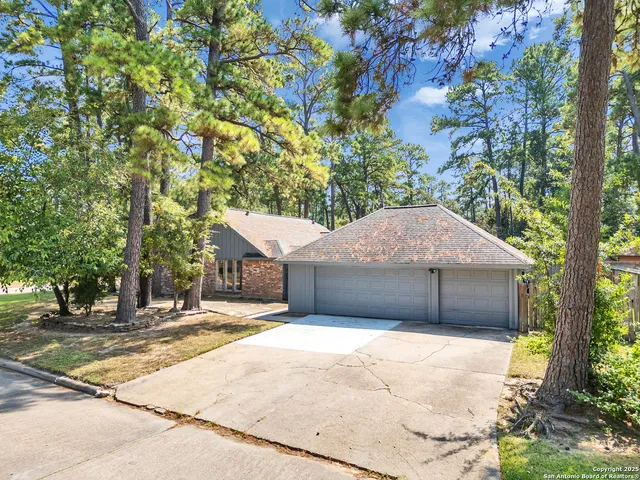 a house with trees in the background