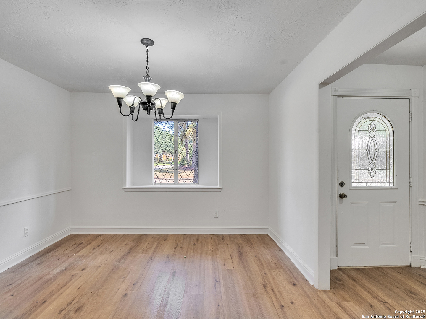 25423 Old Carriage Lane Spring, TX 77373 - Photo 9 of 36 a view of entryway with wooden floor