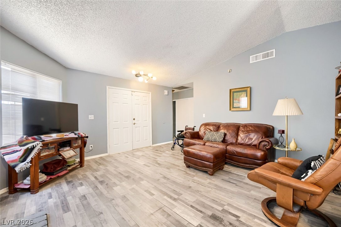 2322 Sabroso Street Las Vegas, NV 89156 - Photo 5 of 17 Step into this comfortable living room featuring a gas fireplace.