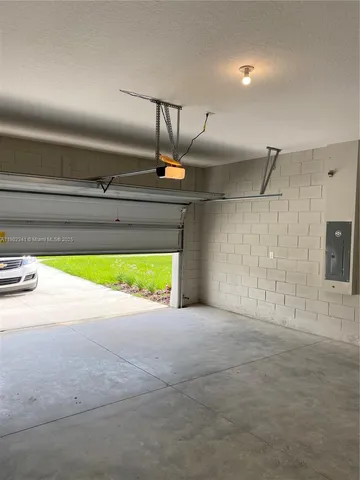 a view of a kitchen with a sink and a window