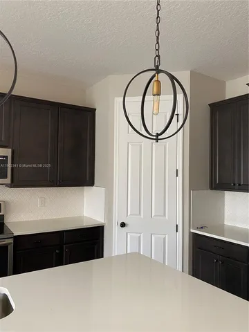 a bedroom with a bed a mirror and a dresser