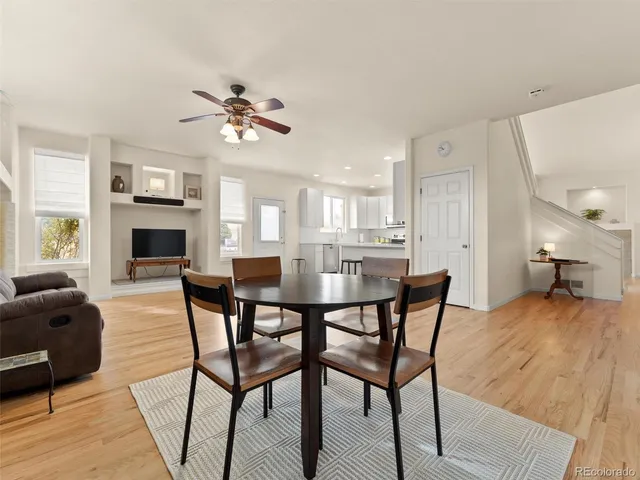 a view of a livingroom with furniture and a ceiling fan