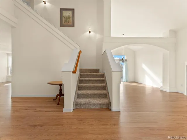 a view of entryway and hall with wooden floor
