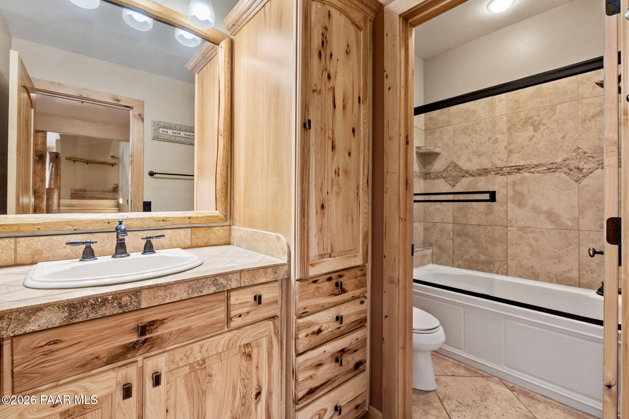 5140 East Charcoal Kiln Road Prescott, AZ 86303 - Photo 73 of 140 a bathroom with a granite countertop sink mirror and a shower