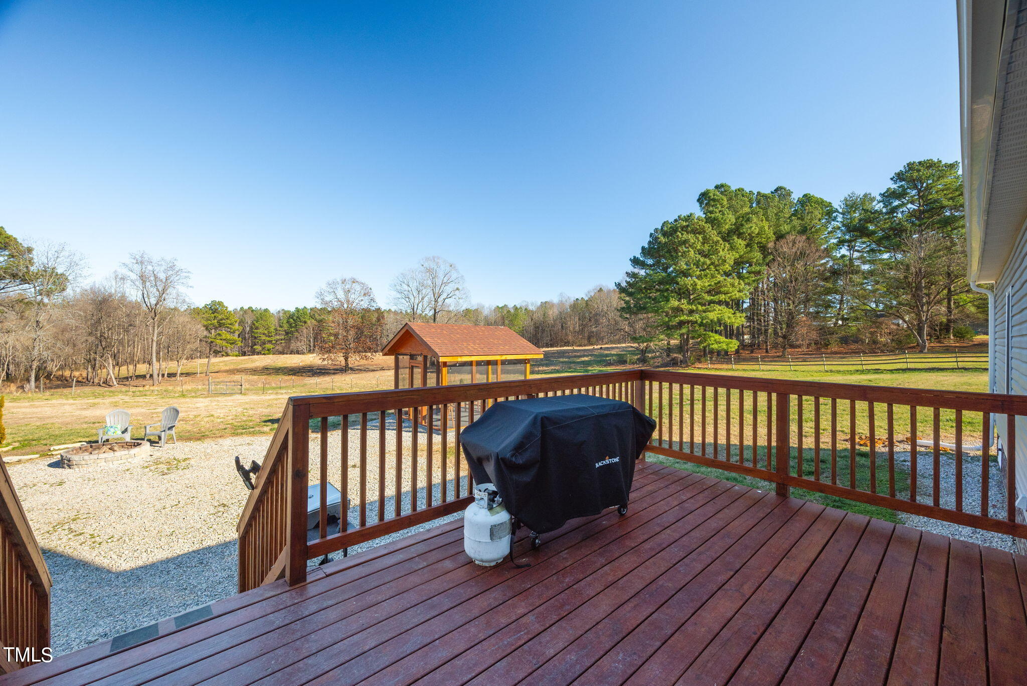 1428 Spring Valley Lake Road Henderson, NC 27537 - Photo 12 of 92 a view of balcony with wooden floor and seating space