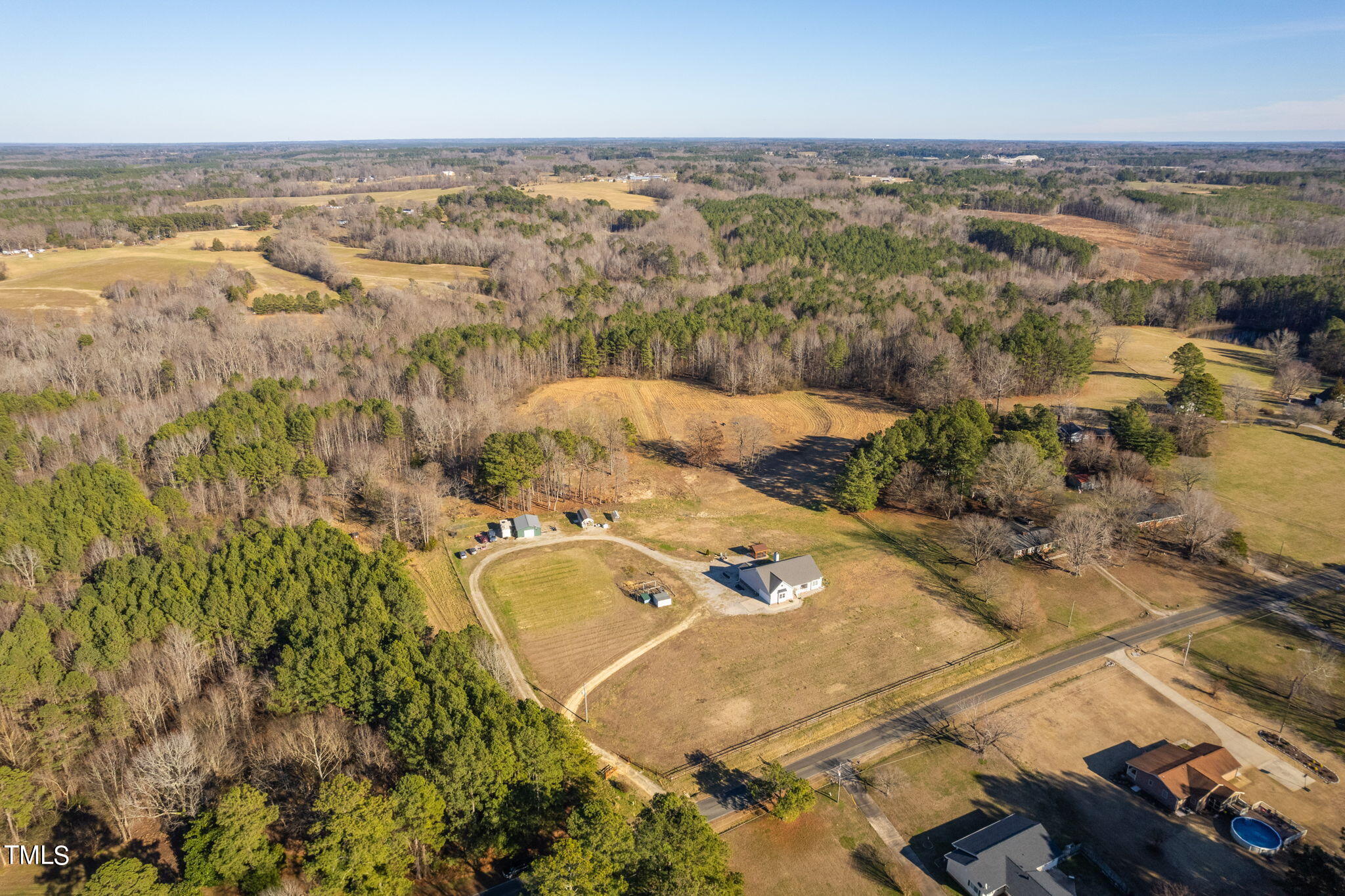 1428 Spring Valley Lake Road Henderson, NC 27537 - Photo 28 of 92 an aerial view of a house with a yard and lake view