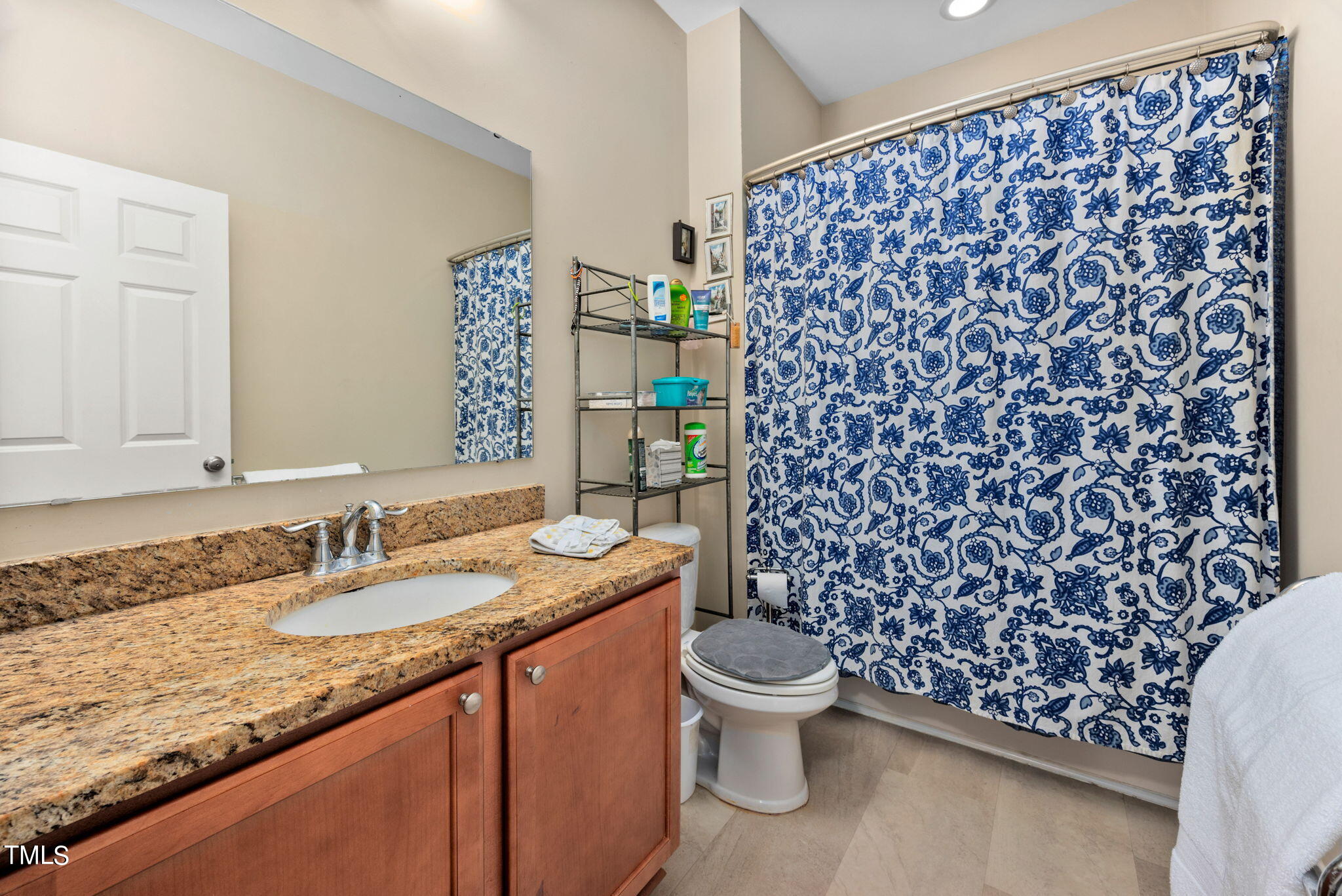 1428 Spring Valley Lake Road Henderson, NC 27537 - Photo 44 of 92 a bathroom with a granite countertop sink toilet and shower
