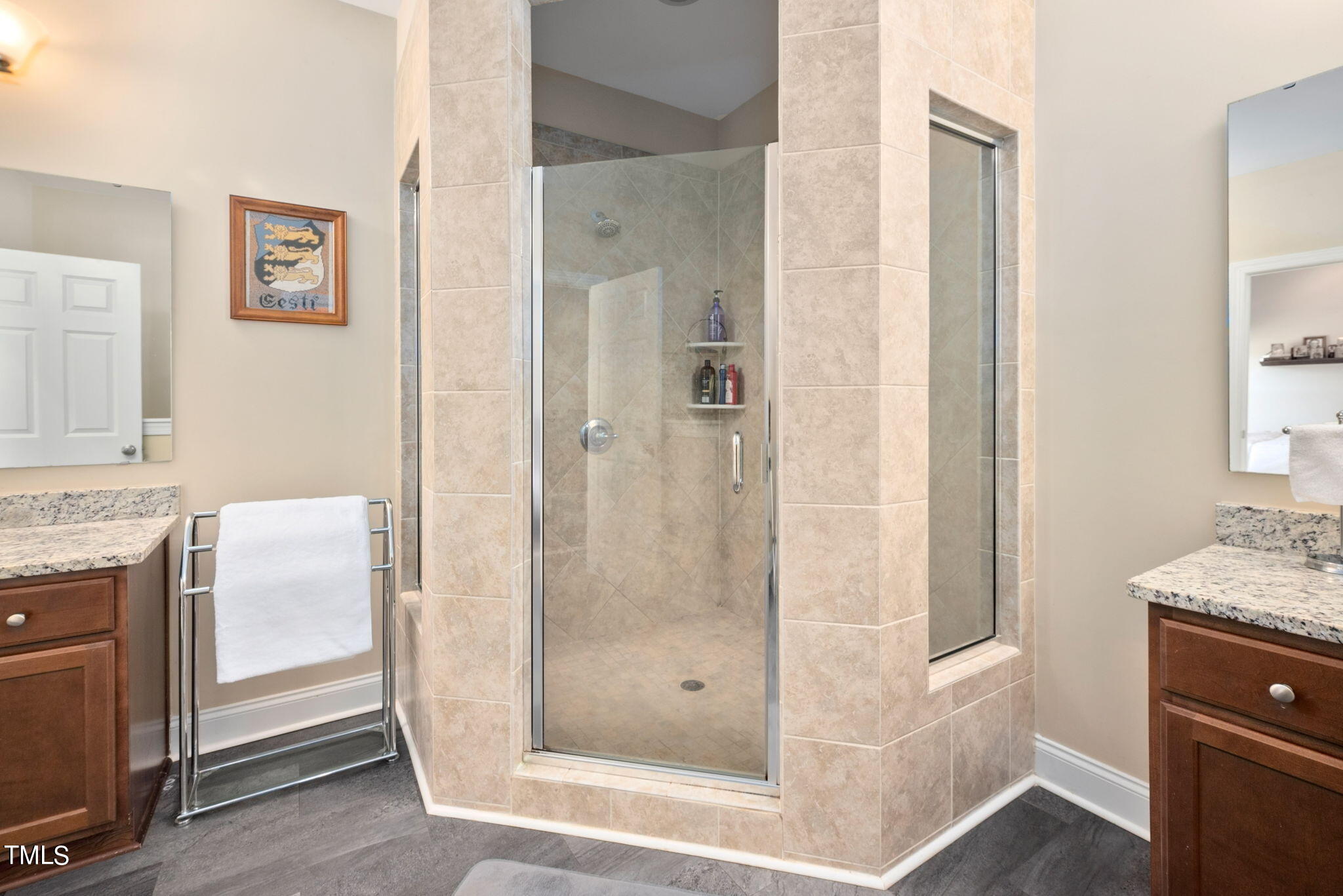 1428 Spring Valley Lake Road Henderson, NC 27537 - Photo 51 of 92 a bathroom with a granite countertop shower mirror and a sink