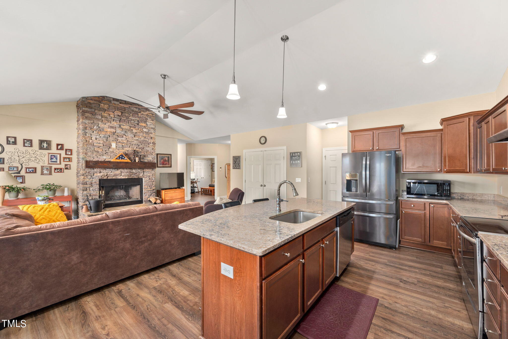 1428 Spring Valley Lake Road Henderson, NC 27537 - Photo 63 of 92 a kitchen with stainless steel appliances granite countertop a sink a counter space and stainless steel appliances
