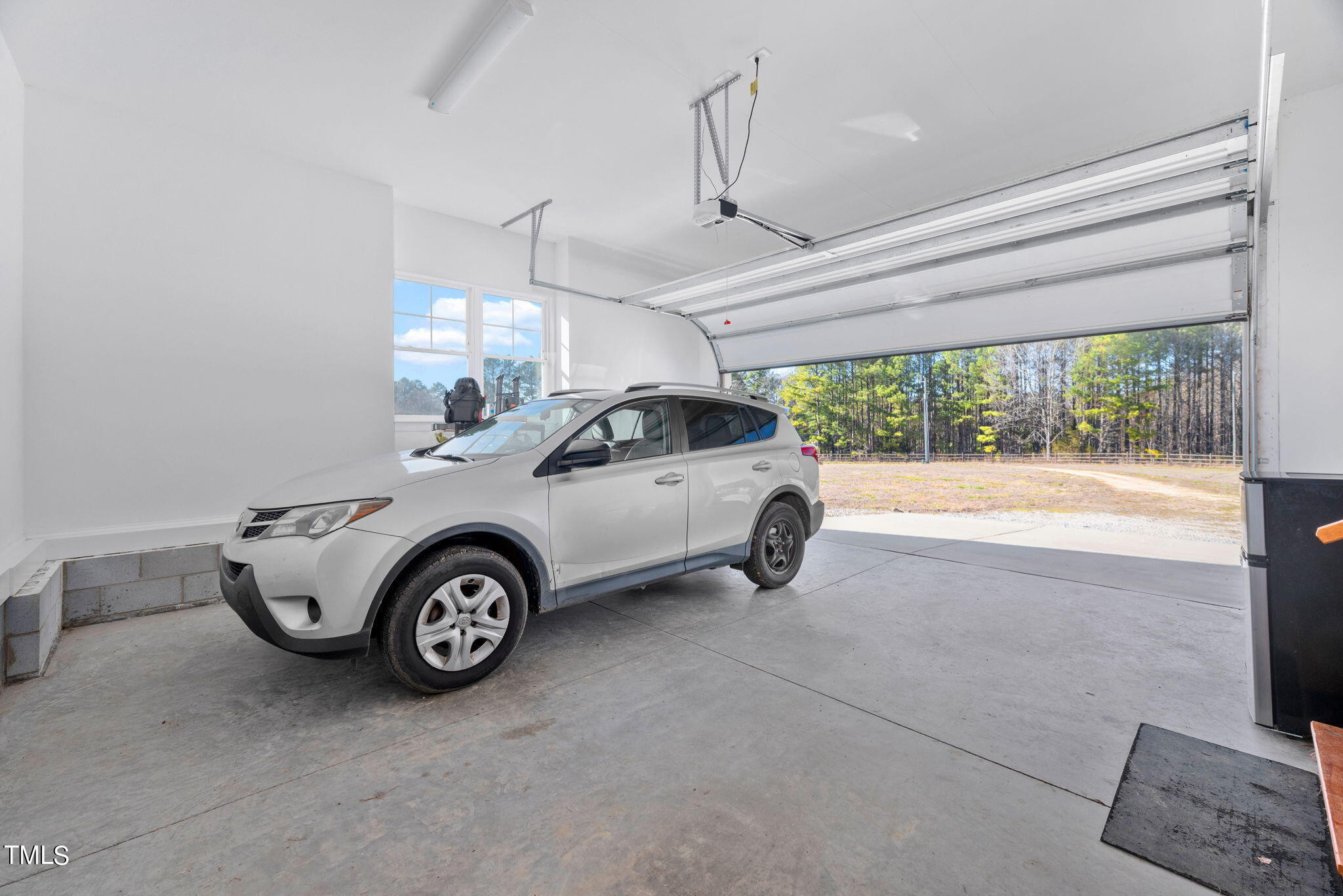 1428 Spring Valley Lake Road Henderson, NC 27537 - Photo 68 of 92 a view of a car parked in garage