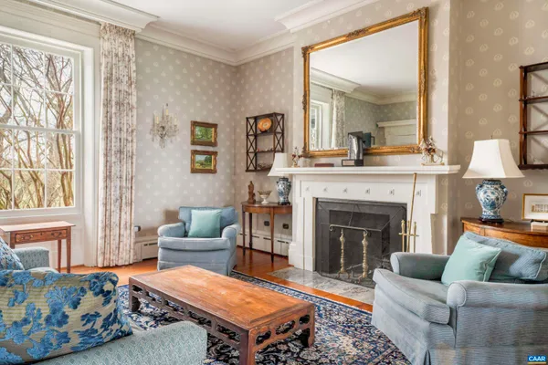 a living room with furniture and a fireplace