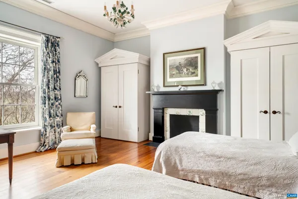 a bedroom with a bed and dresser