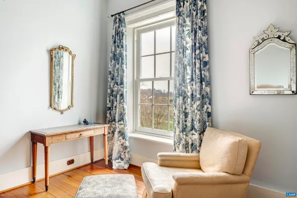 a view of a livingroom with furniture and a fireplace