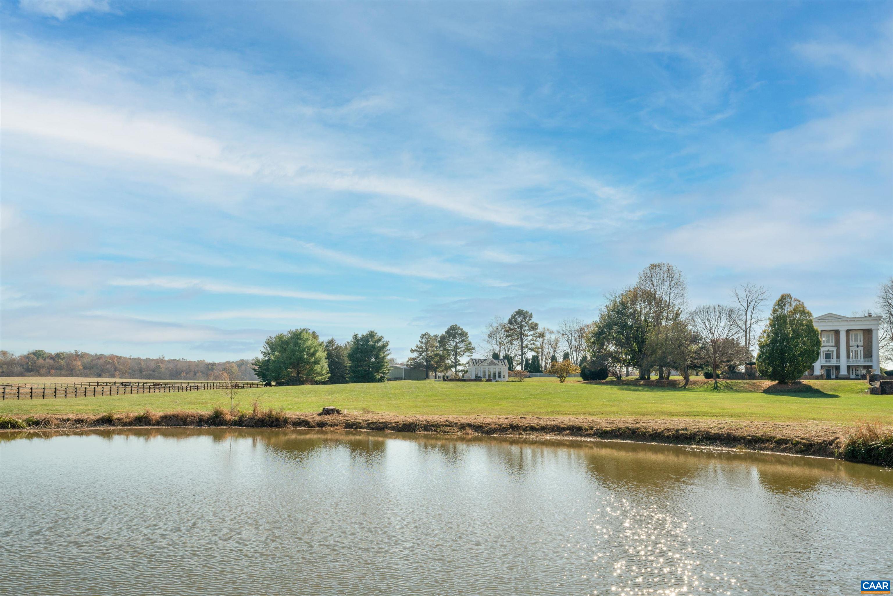 23501 A Greenville Road Culpeper, VA 22701 - Photo 53 of 69 a view of a lake with houses in the background