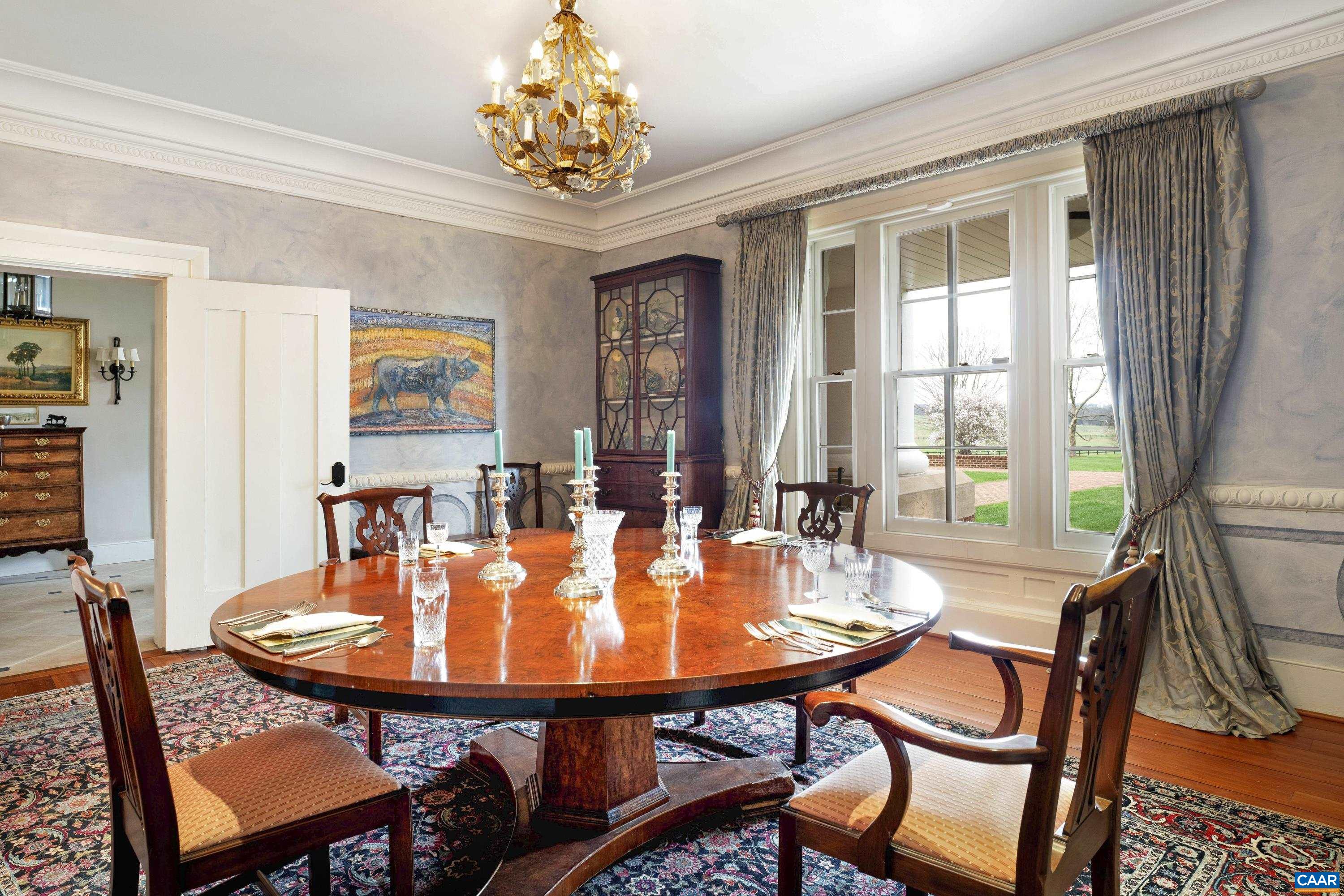 23501 A Greenville Road Culpeper, VA 22701 - Photo 10 of 69 a dining room with furniture a chandelier and wooden floor