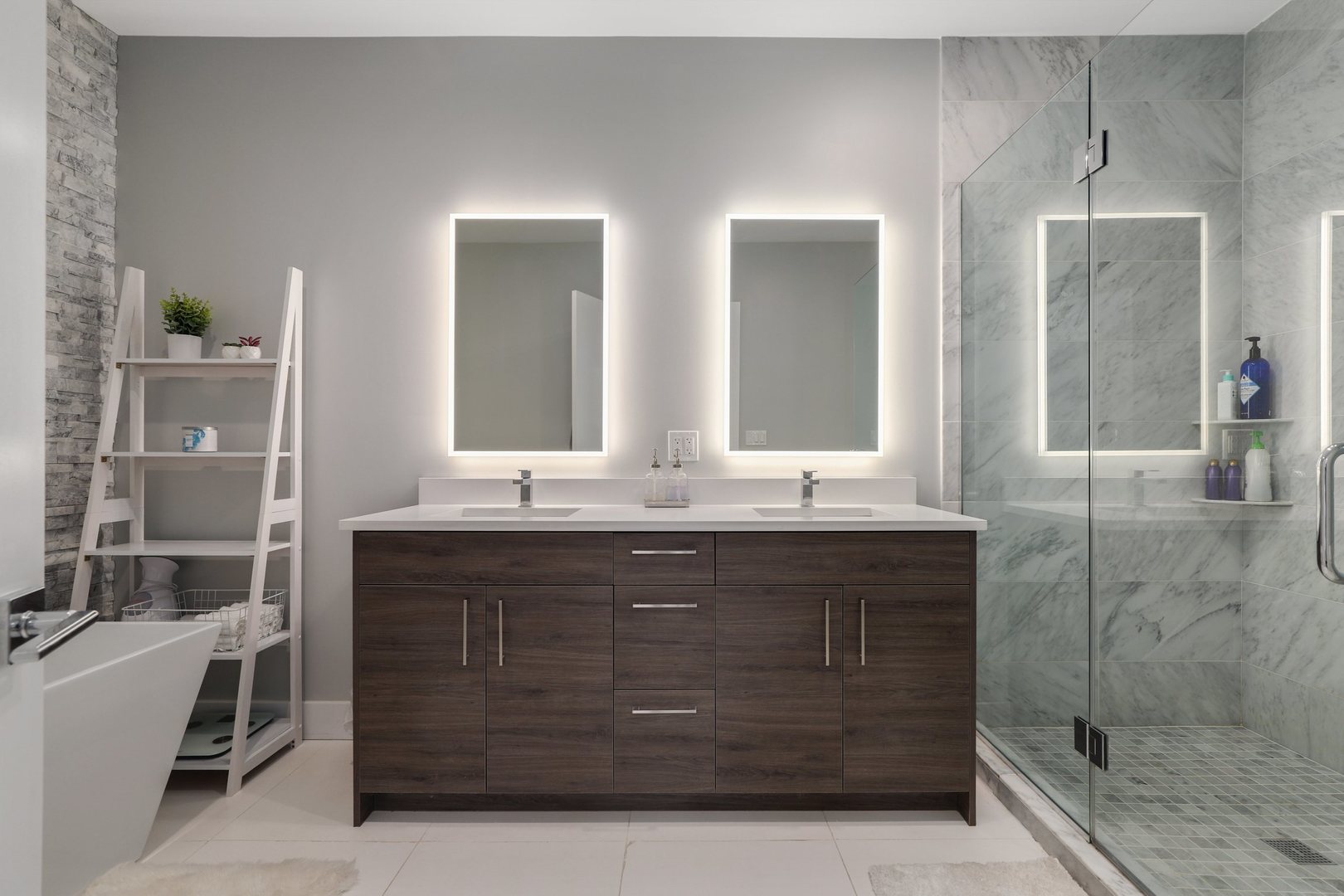 730 West 17th Place, Unit 1W Chicago, IL 60616 - Photo 13 of 26 a bathroom with a granite countertop sink a mirror and shower