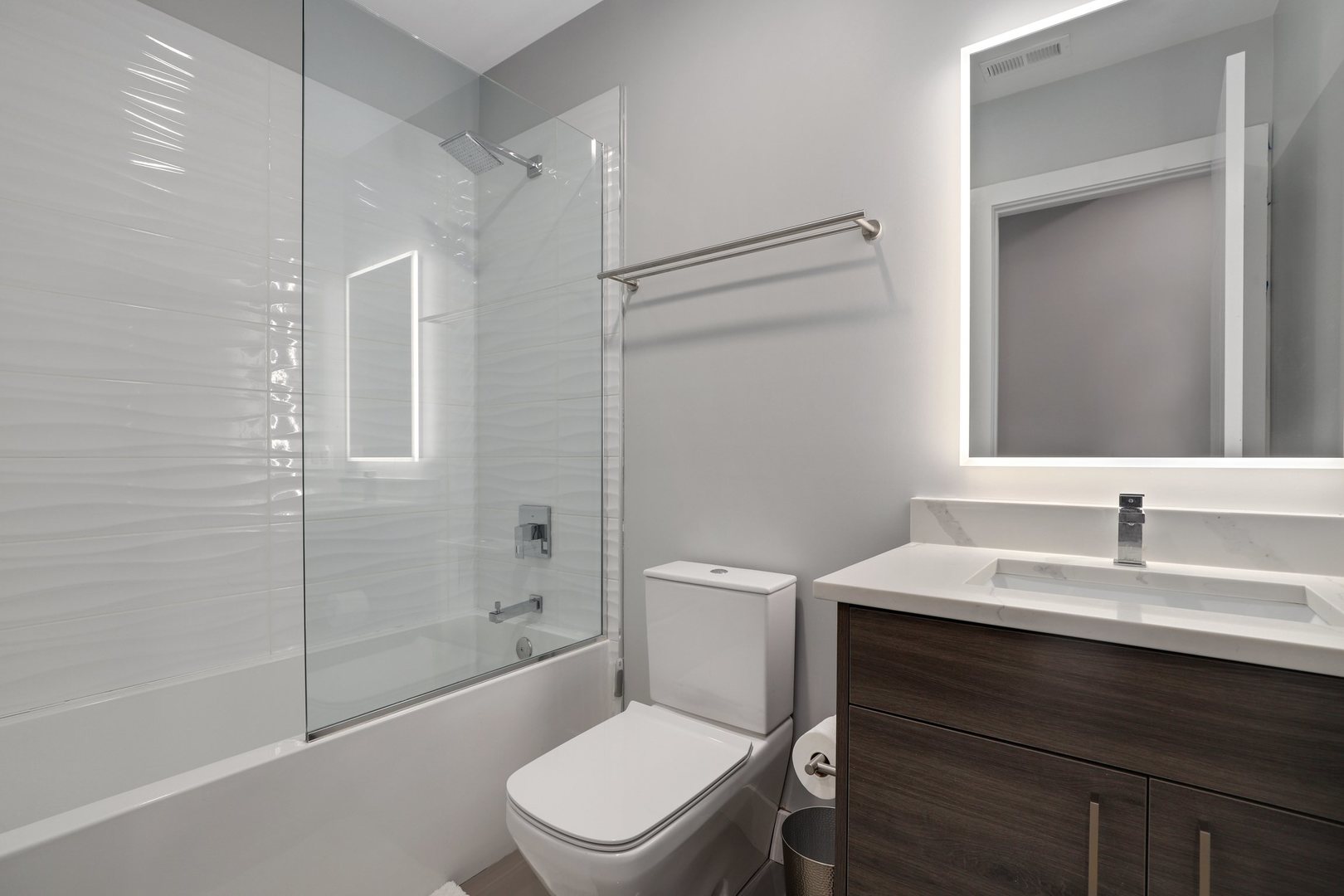 730 West 17th Place, Unit 1W Chicago, IL 60616 - Photo 20 of 26 a bathroom with a sink a toilet and shower