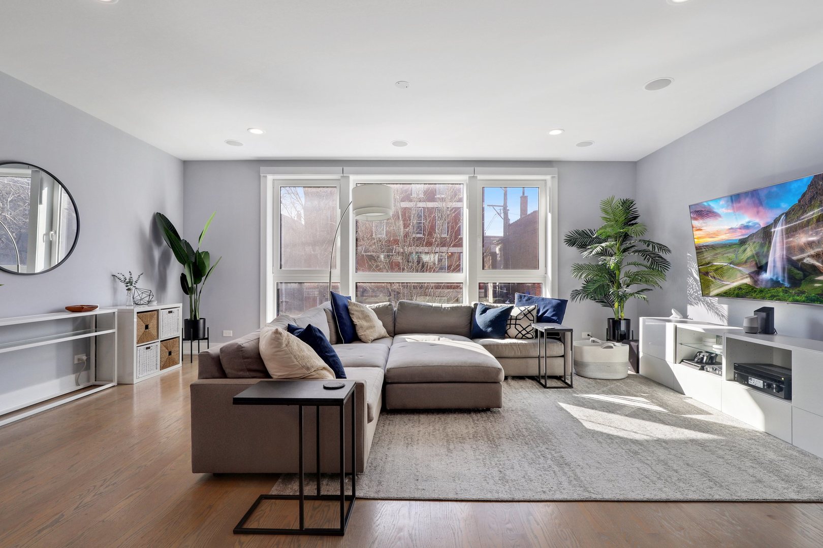 730 West 17th Place, Unit 1W Chicago, IL 60616 - Photo 5 of 26 a living room with furniture large window and potted plants