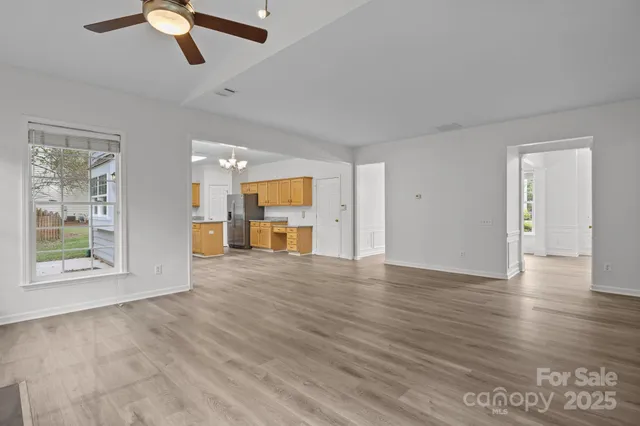 a bathroom with a sink a toilet and a window