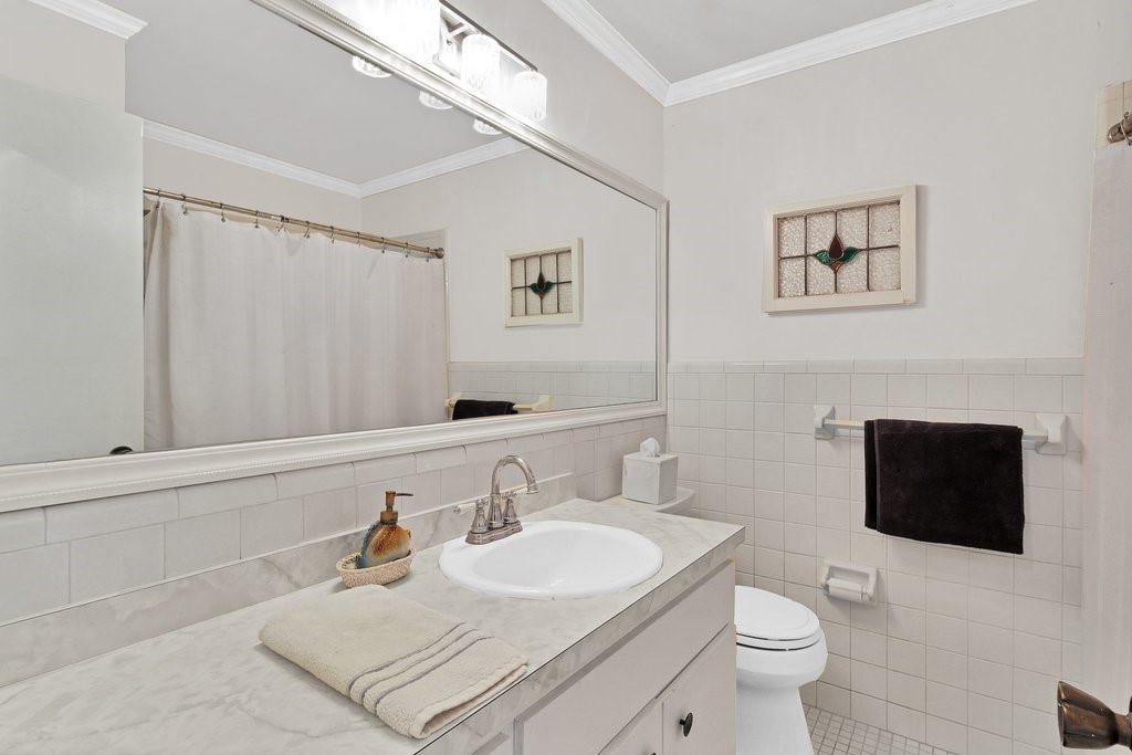 549 Layport Drive Sebastian, FL 32958 - Photo 20 of 35 a bathroom with a sink toilet a mirror and shower