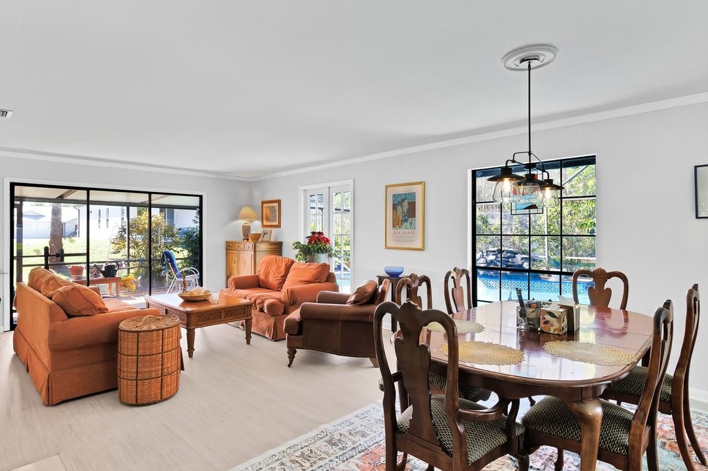 549 Layport Drive Sebastian, FL 32958 - Photo 5 of 35 a dining room with furniture a chandelier and window