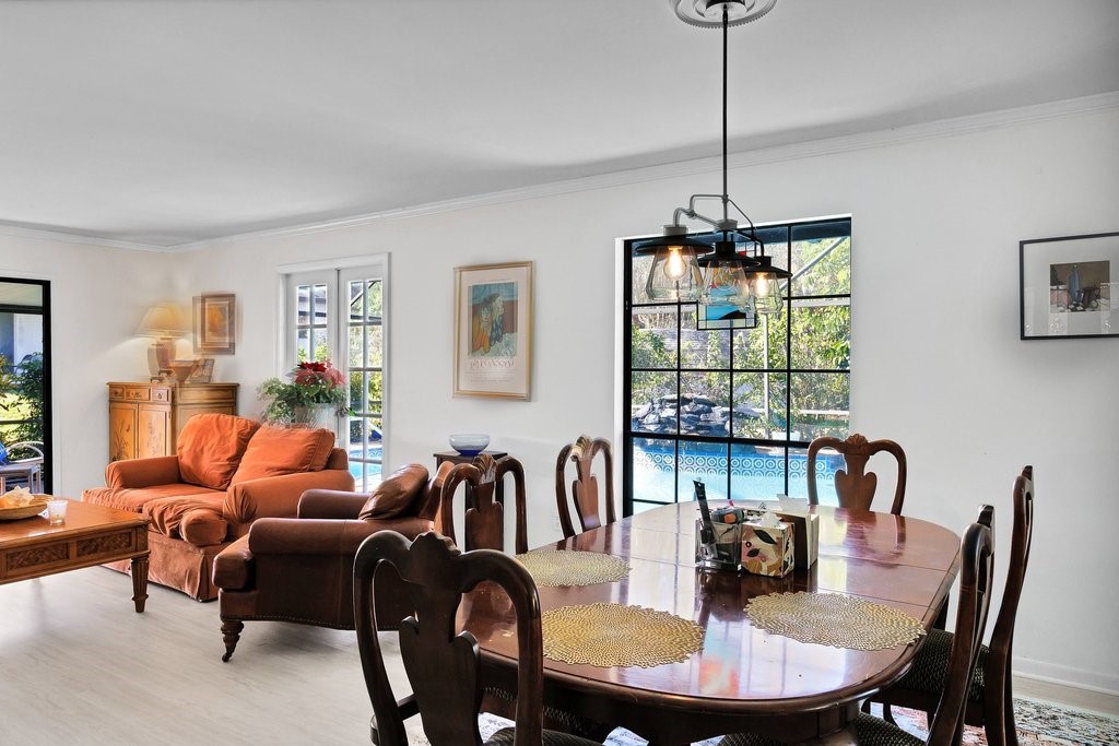 549 Layport Drive Sebastian, FL 32958 - Photo 10 of 35 a dining room with furniture a chandelier and window