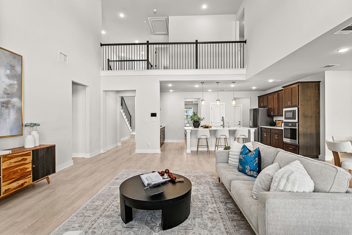 1265 Hazy Hills Loop Dripping Springs, TX 78620 - Photo 13 of 40 a living room with furniture and a table