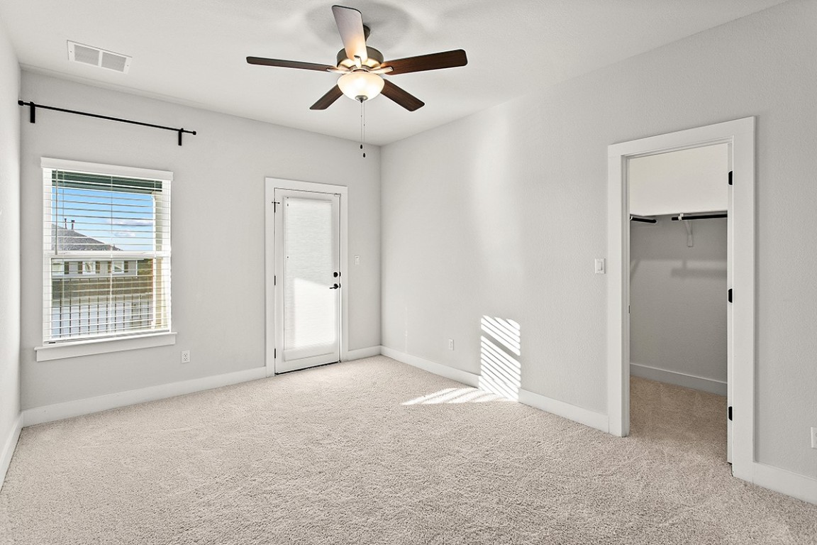 1265 Hazy Hills Loop Dripping Springs, TX 78620 - Photo 24 of 40 a view of an empty room with a window
