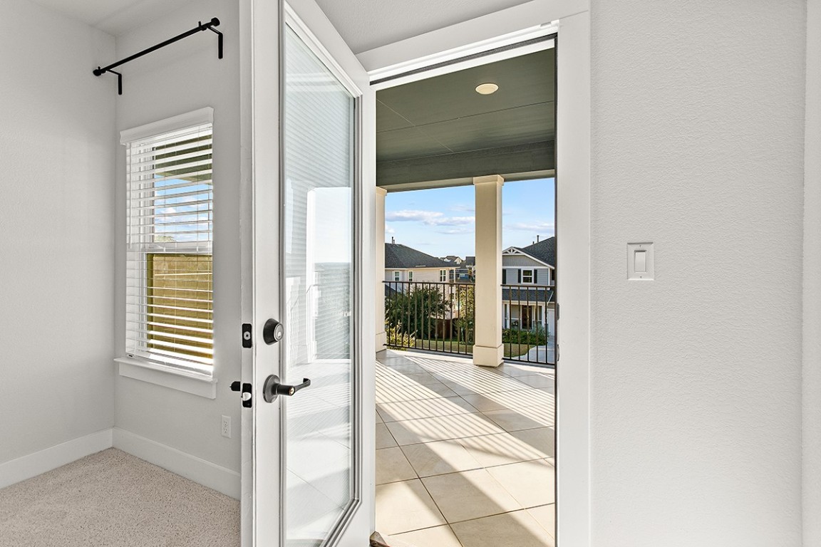 1265 Hazy Hills Loop Dripping Springs, TX 78620 - Photo 25 of 40 a view of a bathroom with a glass door