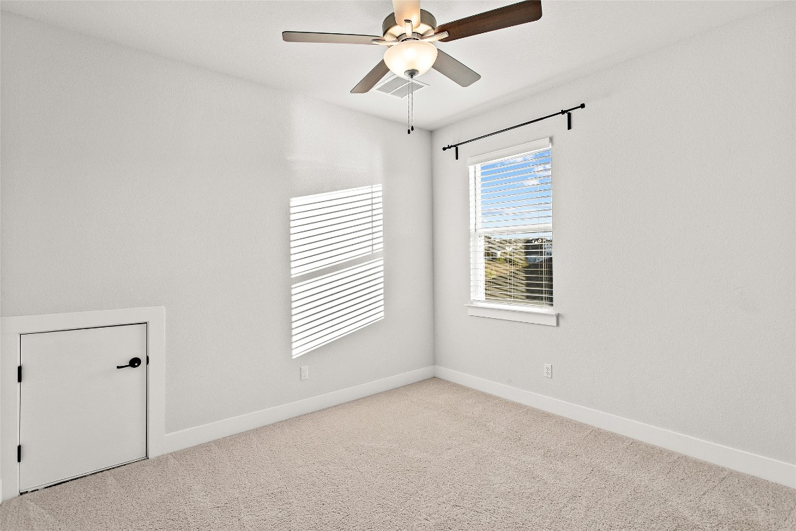 1265 Hazy Hills Loop Dripping Springs, TX 78620 - Photo 31 of 40 a view of an empty room with a window