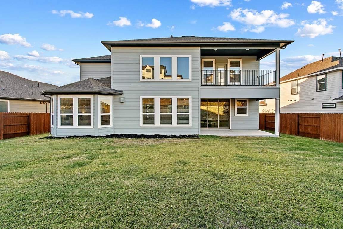 1265 Hazy Hills Loop Dripping Springs, TX 78620 - Photo 36 of 40 a front view of a house with a garden