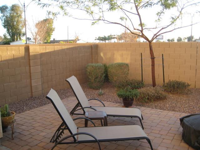 3247 East Tyson Street Gilbert, AZ 85295 - Photo 14 of 34 a view of a chairs and table in backyard