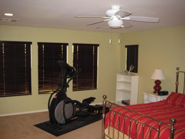 3247 East Tyson Street Gilbert, AZ 85295 - Photo 21 of 34 a bedroom with a bed and a chandelier