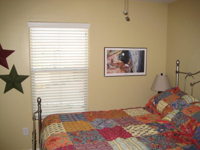 3247 East Tyson Street Gilbert, AZ 85295 - Photo 26 of 34 a bedroom with a bed and a painting on the wall