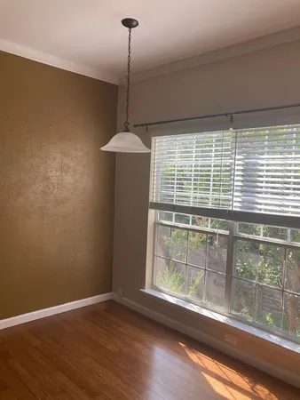 a view of a room with a large window