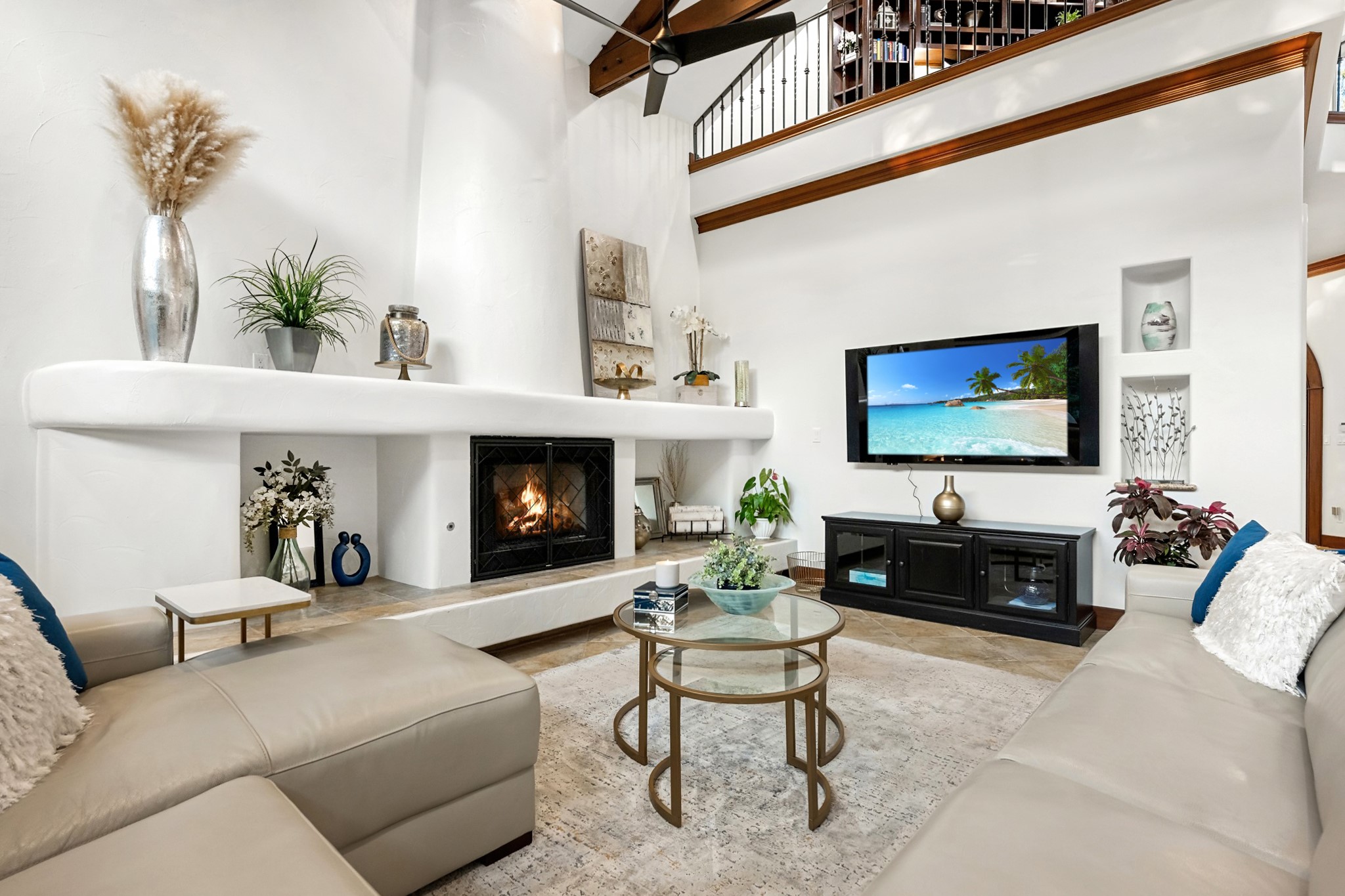 407 Hurst Creek Road Lakeway, TX 78734 - Photo 7 of 40 The hand-troweled Santa Barbara style fireplace is one of THREE interior fireplaces!