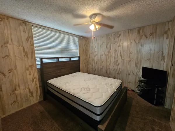 a room with pool table and flat screen tv