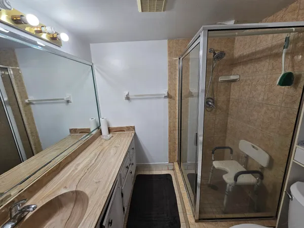 a bathroom with a tub and a shower