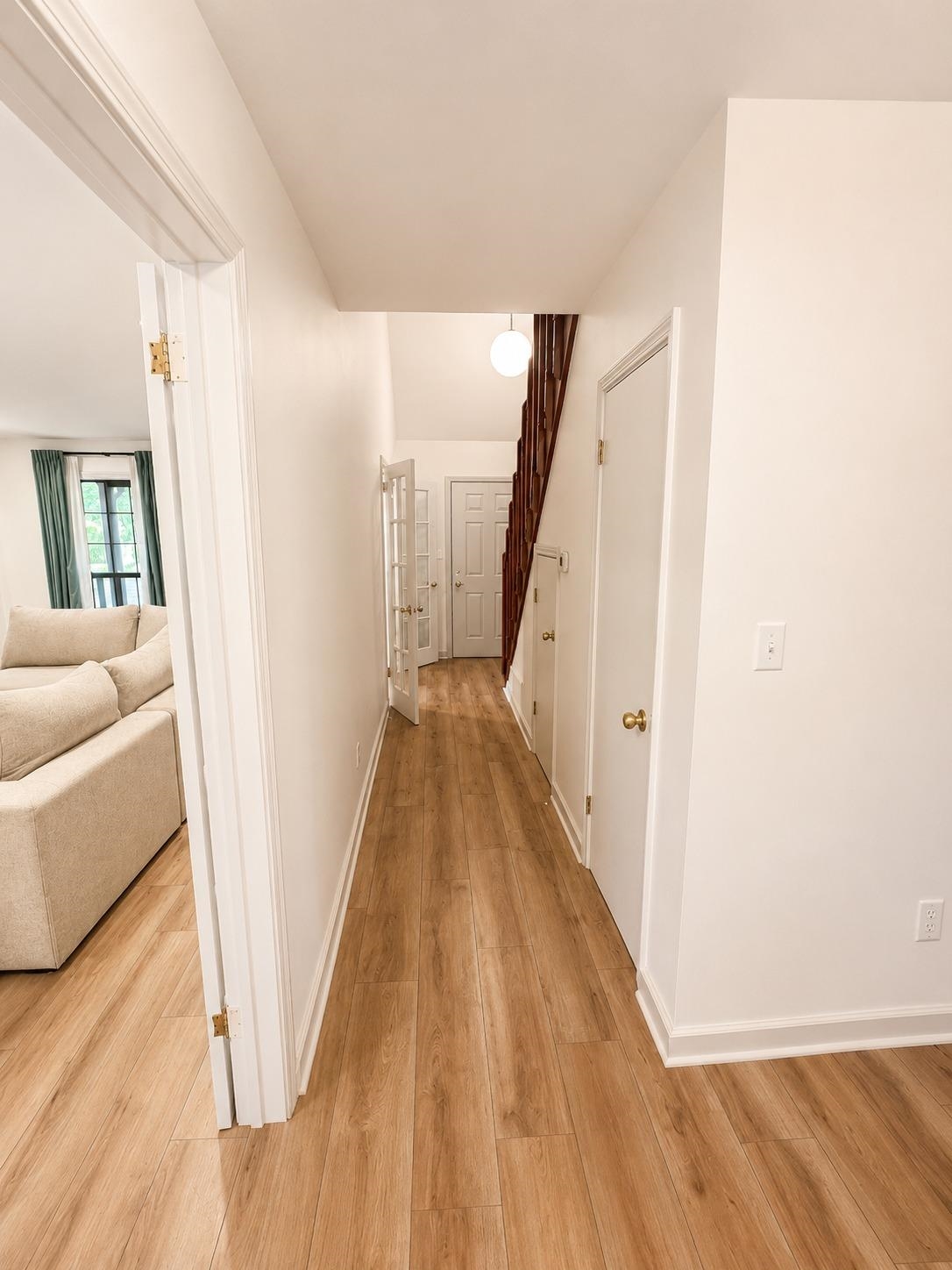 470 Rich Road Somerville, TN 38068 - Photo 23 of 40 Hallway featuring wood-finish flooring, white painted walls, and white trim