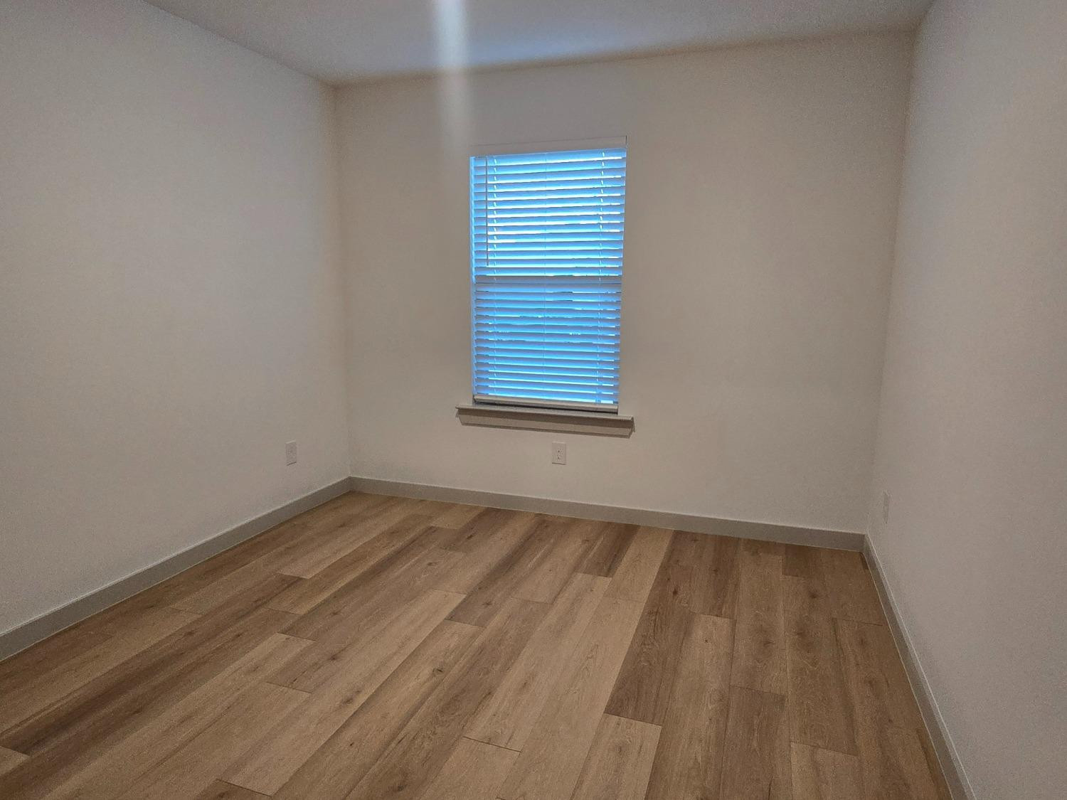 7425 8th Street Lubbock, TX 79416 - Photo 13 of 25 an empty room with a window