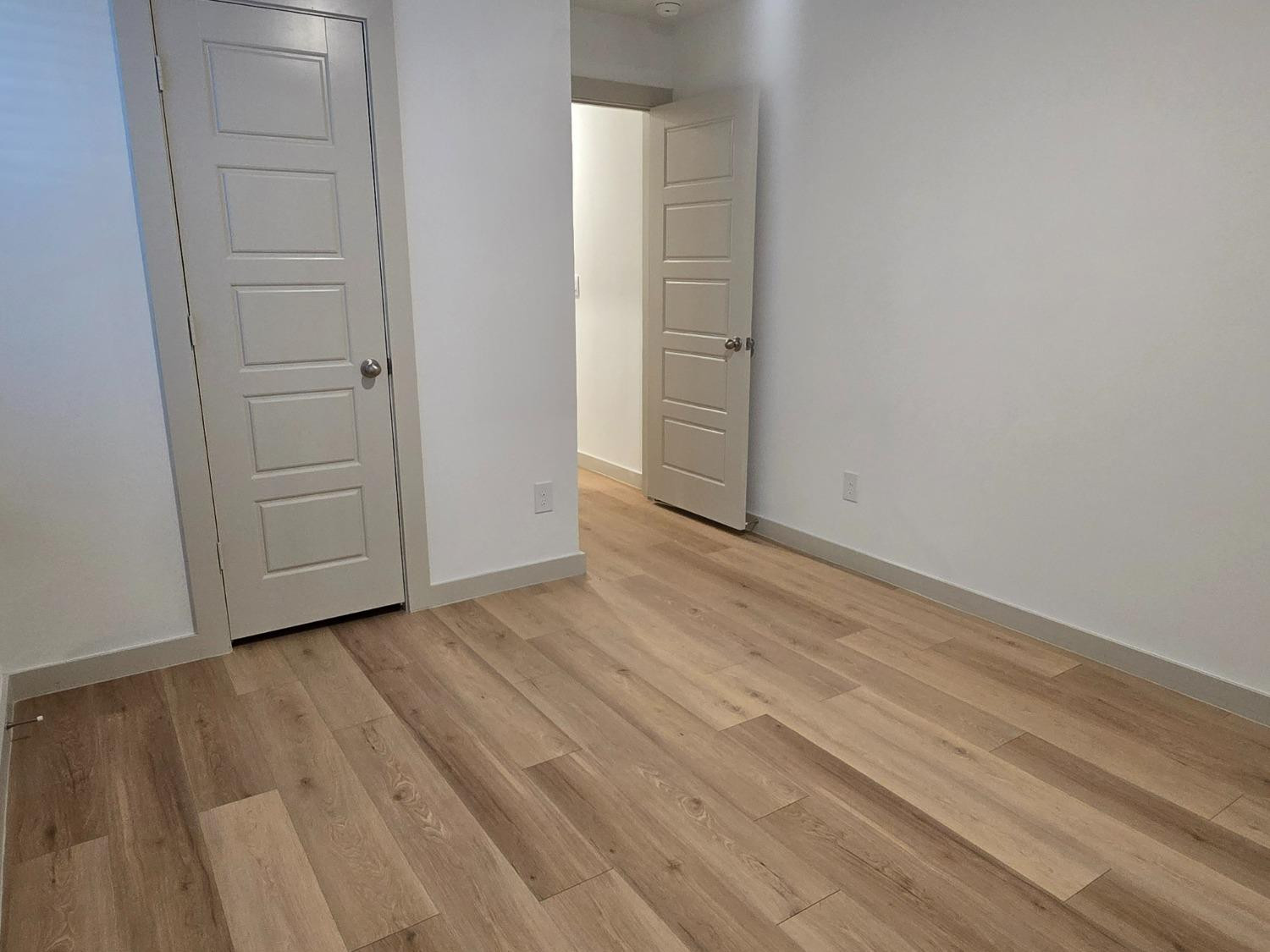 7425 8th Street Lubbock, TX 79416 - Photo 17 of 25 a view of wooden floor and closet in a room