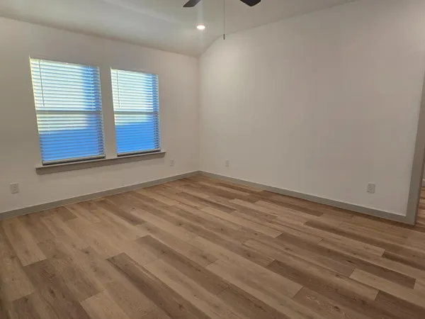 wooden floor and window in an empty room