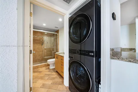 a view of a hallway with washer and dryer
