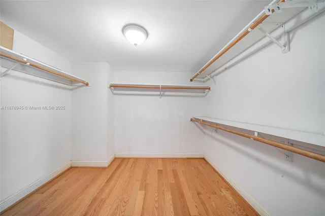 a view of a room with wooden floor and chair