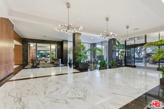 a view of a room window and chandelier